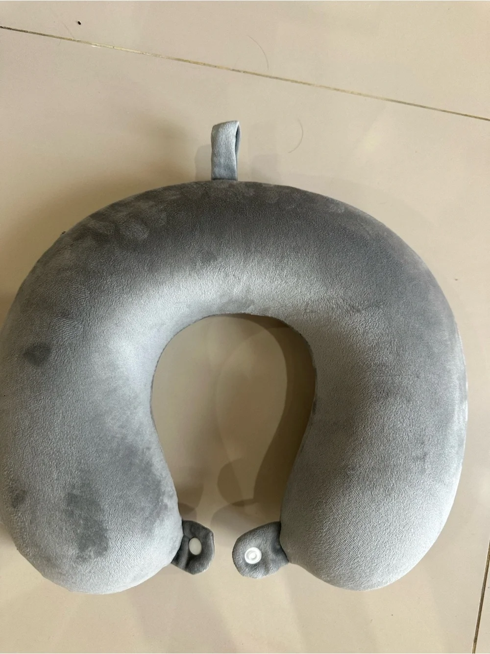 Plush Gray Travel Neck Pillow with Snap Closure